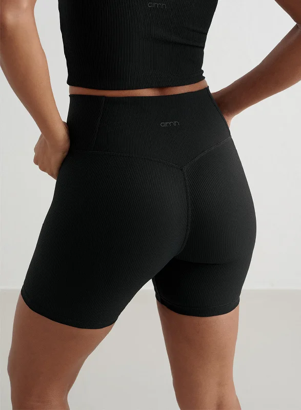 Master Every Pose With Premium Yoga Wear Deals Black Ribbed Performance Midi Biker Shorts